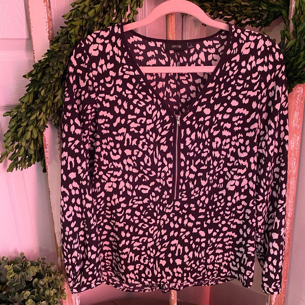 Two medium cheetah print shirts